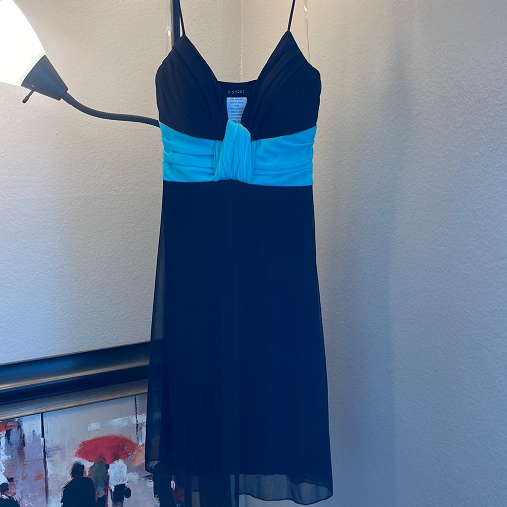 Black dress with a light blue ribboned across the top